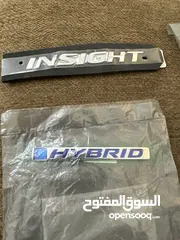  9 قطع هوندا انسايت (دلايات خلفي ، كيبل صندوق ، فصالات غطاء خلفي ،شعار هايبرد، شعار انسايت) اصلي وكاله