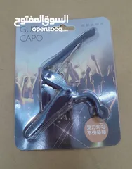  1 new guitar capo, new guitar strap,delivery WhatsApp