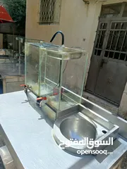  4 طاولات ستانلس وعرباية عصير
