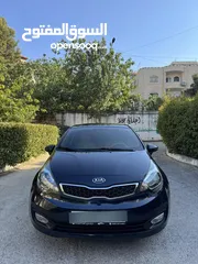  2 كيا ريو 2014 متور 1250 بنزين جير عادي فحص ممتاز  لون كحلي فرش بيج تحكم ستيرنج