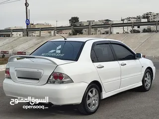  9 ميتسوبيشي لانسر موديل 2007 كويتي جير اتوماتيك لون ابيض للبيع بسعر مناسب