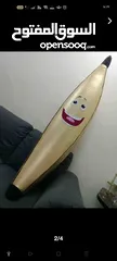  1 موزة ذهبية من القرية العالمية ومجموعة ألعاب - A golden banana from Global Village and a set of toys