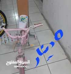 2 دراجة هوائية وعربانة اطفال