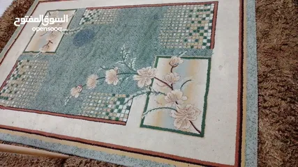  2 سجاده مستعمله طولها مترين و30 والعرض متر و70