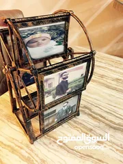  1 برواز ديكور   دولاب صور  على الوجهين او شكل  طولي دوار  مع موسيقى