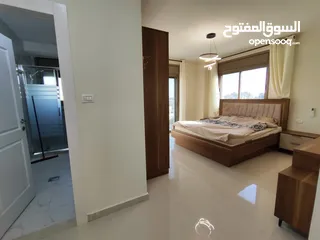  8 شقة بإطلالة عالية في قلب عين منجد – فرصة لا تعوّض