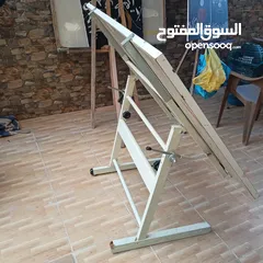  2 طاولة مرسم عندسي ..وعلاقة ملابس (شماعه)