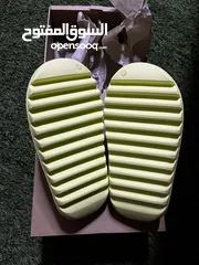  3 Yeezy slides glow green