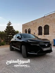  12 Honda E:NS1 E4 electric 2023  هوندا e:ns1 فئة E4 فل اضافات، اسود ميتاليك، داخليه لون ابيض فخمة