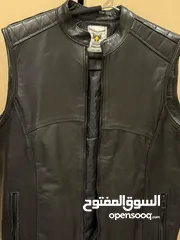  6 Original leather Biker’s vest and various helmets