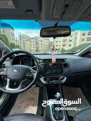  3 كيا برايد هاتش باك موديل 2014 فحص 4 جيد سعة الموتور 1600 سي سي الشكل رياضي لون ابيض سقف اسود