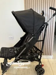  8 عرباية  اطفال mothercare لون اسود ورمادي