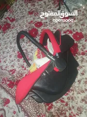  9 كوت أطفال شبه جديد   معاه كوفليه لون .احمر واسود
