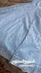  2 ‏فستان سهرة ‏قصير نوعا ما لونه ازرق سماوي ‏