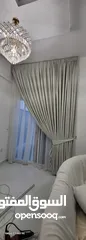  2 Quality House curtains and sofa