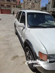  9 كيا سبورتاج موديل 2000 لون ابيض ماتور 2000 توماتيك