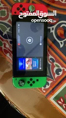  1 نينتيندو سويتش + 2 joy con إضافيتان مع شمعة مع مسكتين مع اغراضه ( بدون ألعاب )و شنتة
