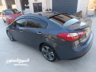  7 كيا سيراتو موديل 2014 ما شاء الله فول اضافات فتحة سقف حساس امامي خلفي شركة ليد امامي وخلفي سبويلرات