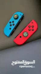  2 نينتيندو سويتش + 2 joy con إضافيتان مع شمعة مع مسكتين مع اغراضه ( بدون ألعاب )و شنتة