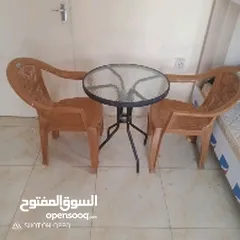  1 small dining table with two chair