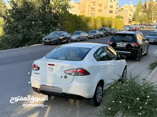  4 مازدا زوم 2 موديل 2012 فحص كامل 7 جيد ولا ملاحظة لون ابيض قاطعة مسافة 100 الف كيلو فقط (استخدام شخصي