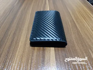  16 محافظ رجالي حجم صغير جلد صناعي وحافظة بطاقات لون اسود كاربون فايبر