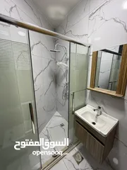  30 شقه طابق ارضي 144متر مع ترس 30 متر للبيع في جبيهه حي المنصور بموقع مميز