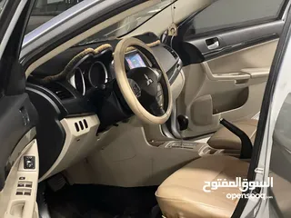  19 ميتسوبيشي لانسر 2016 كرت ابيض