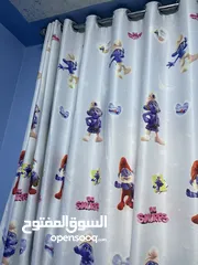  1 برادي غرفة اطفال رينقات لون ازرق برسومات السنافر تفصيل