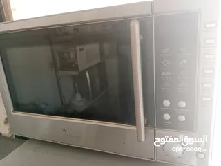  8 ميكرويف مع فرن حجم كبير/شغال 100/100لون سلفر للبيع المستعجل