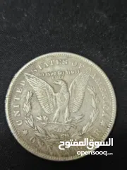  2 هذه العملة هي دولار مورغان (Morgan Dollar) أمريكي