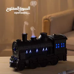  2 قطار البخار الصغير مش بس ملطف جو... تحفة فنية تنفث راحة وعطر! عيش تجربة بخار خرافية... جو دافئ،