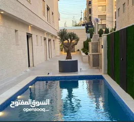  16 شقة فاخرة بإطلالة  مميزة بارقى مناطق عمان الغربية الجبيهة ارضي واخير مع رووف وطوابق