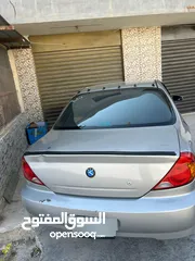  4 كيا سبكترا للبيع شغل وامشي بصلاة على النبي والله مهي بحاجه الى اشي