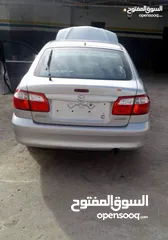  1 زجاج مازدا 626 خلفي موديل 2002