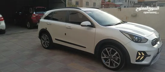  12 كيا نيرو 2021 جمرك جديد وارد كوري ممشي 32  الف فحص كامل جنطات تورنج