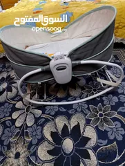  1 كاروك هزاز مستخدم مع سرير طفل للبيع