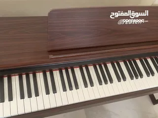  2 Greaten piano new model amazing brownish black color no key broken functioned with metronome