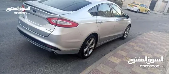  9 فورد فيوجن 2014 هايبرد كلين فحص كامل لون سلفر بحالة الوكالة