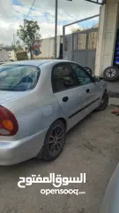  4 سيارة دايو لانوس اوتوماتيك موضيل 2002 متور 1.6 مرخصة مأمنة ، السيارة لعبة