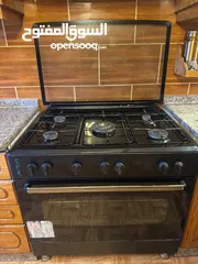  6 فرن غاز و غسالة اوتوماتيك و طاولة سفرة