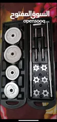  21 30 kg dumbbells new only silver cast iron with the bar connector and the box
