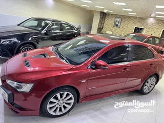  14 ميتسوبيشي لانسر موديل 2015 GT اصلي فحص كامل بحالة الوكاله فل كامل اعلى صنف من فئتها