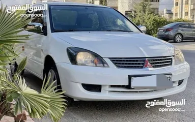  1 ميتسوبيشي لانسر 2013 ماتور 1600 سيارة خالية من اي عيوب بسعر حرق 5000 دينار السعر نهائي