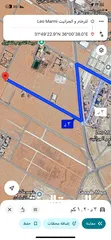  1 قطعتين متلاصقات في اجمل مناطق رجم الشامي الغدير الجنوبي منطقة فلل على شارع عمان التنموي مباشرة المطا