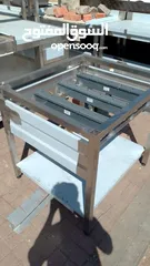  22 stainless steel items like table sink hood, shelves,etc