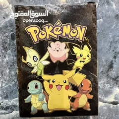  11 كروت بوكيمون والبومات (Pokemon cards and binders)