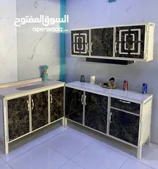  6 كاونتر قياس متر ونص ارضي وملحق مع سنك متر و 20 سم و السنك مرمر صناعي وتوصيل داخل بغداد مجاني