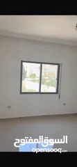 8 Excellent natural light and winds with views of Shafa Badran from the highest level in the building.