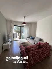  1 شقه مفروشة للايجار في دير غبار ارضية مع حديقه إماميه وترس خلفي .. مميزه جداً